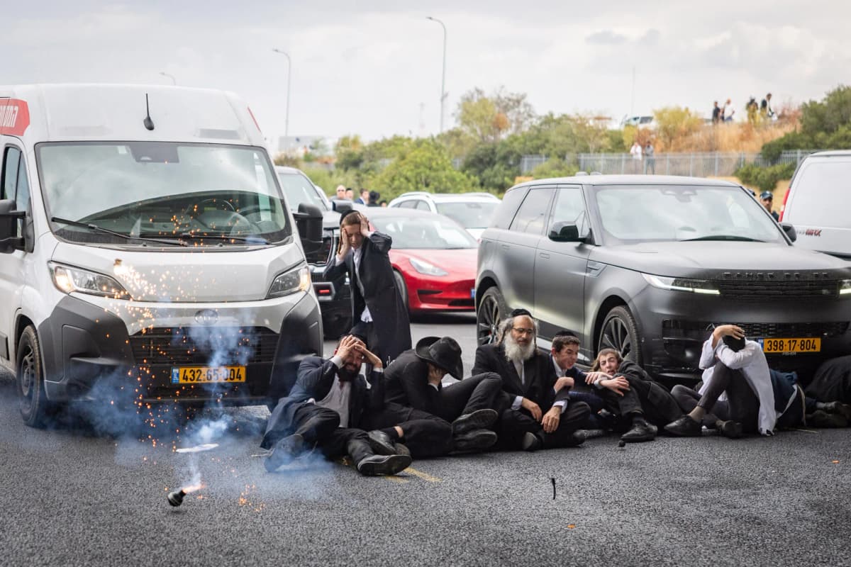 Ultra-Orthodox block main highway in rush hour protest over draft dodgers’ arrest