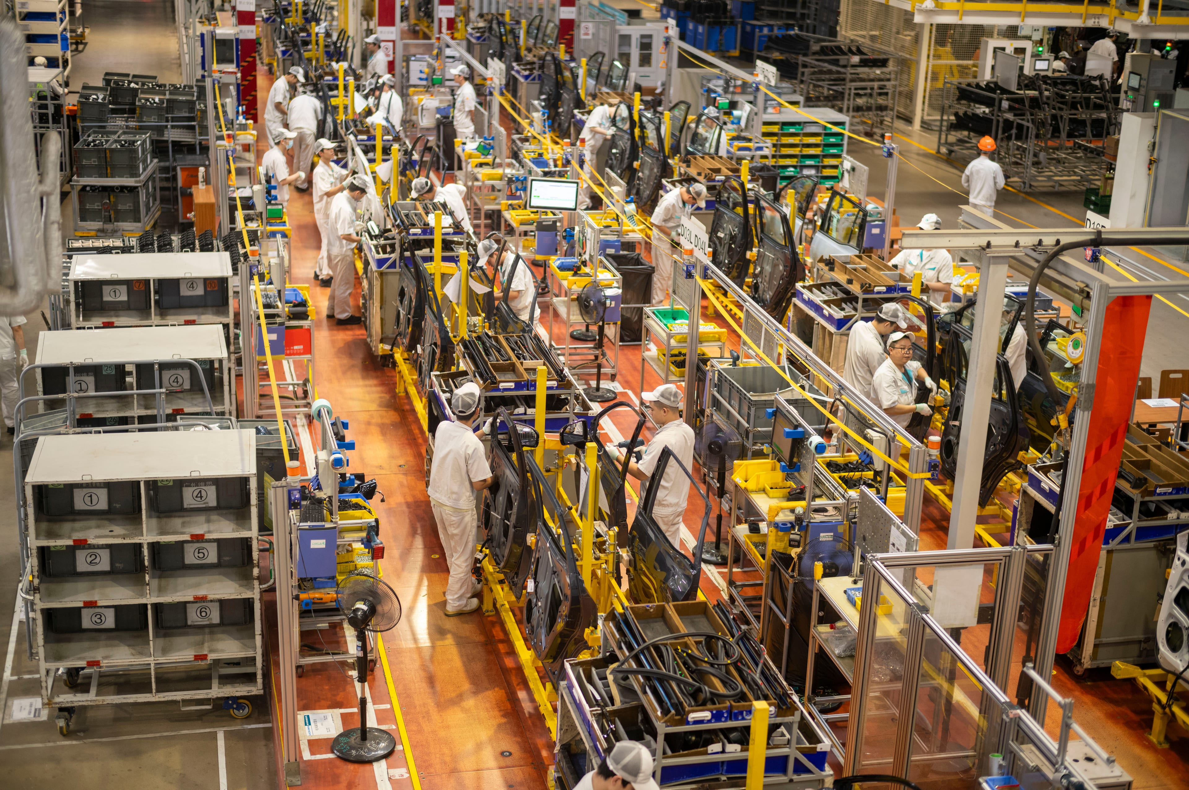 China's Economy Sends Mixed Signals: Factories Boom, Shoppers Stay Home