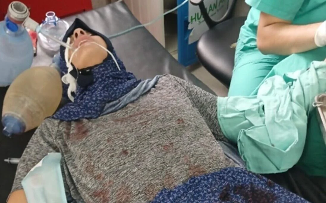 Former hostage shares photos from captivity, as Hamas doctor operates on her injured hand
