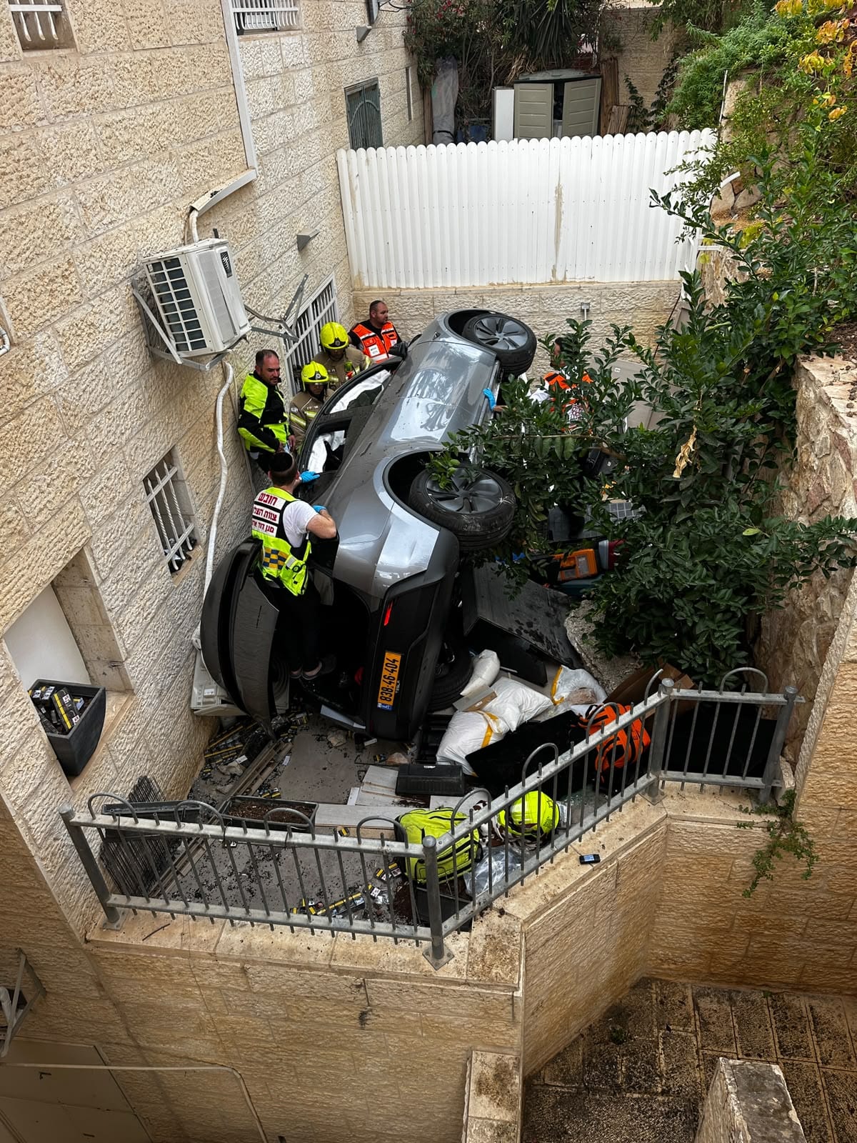 Woman Rescued After Car Plunges Five Meters Into Jerusalem Garden