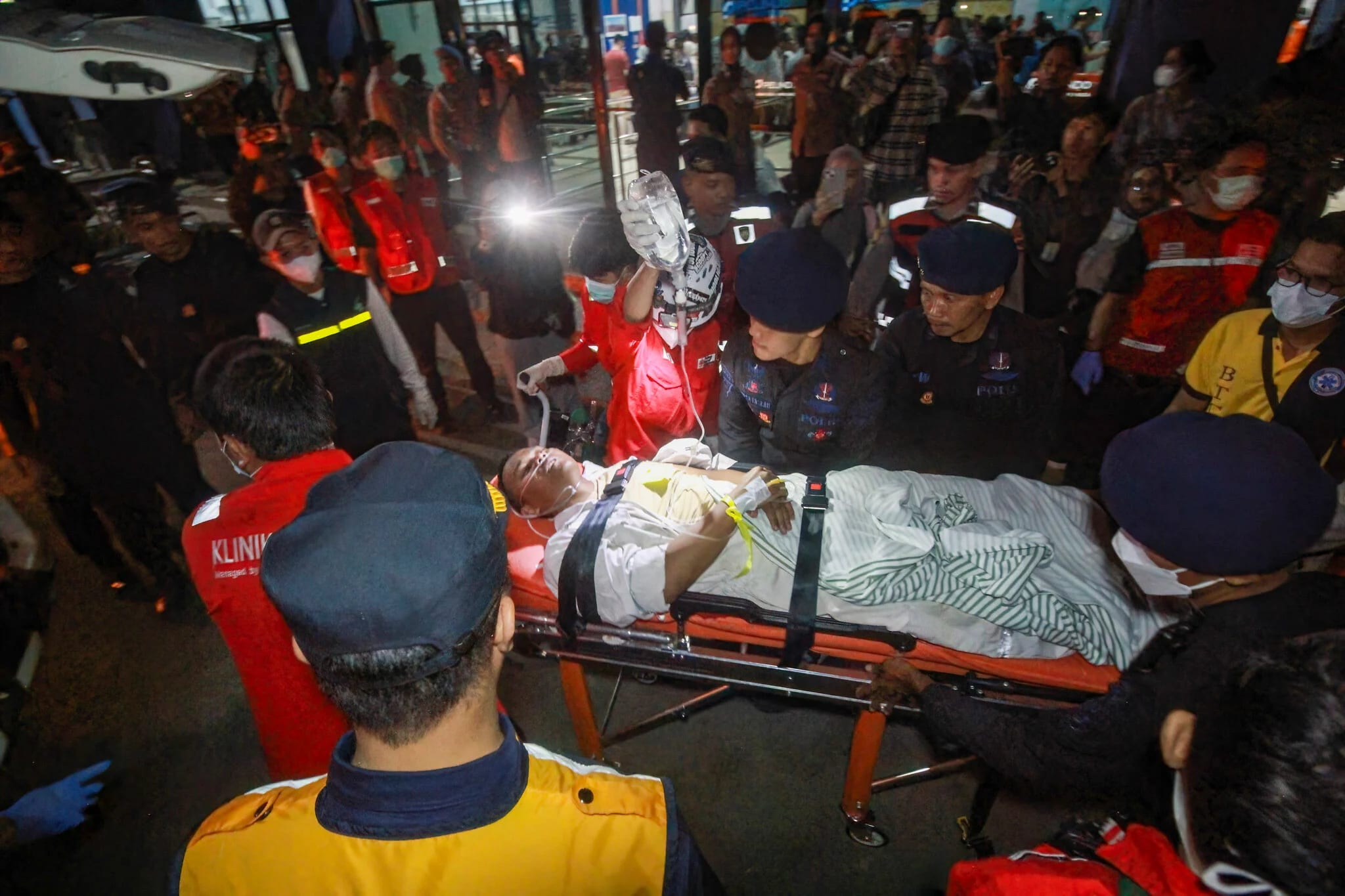 Search underway for some 130 people after Indonesian ferry overturns